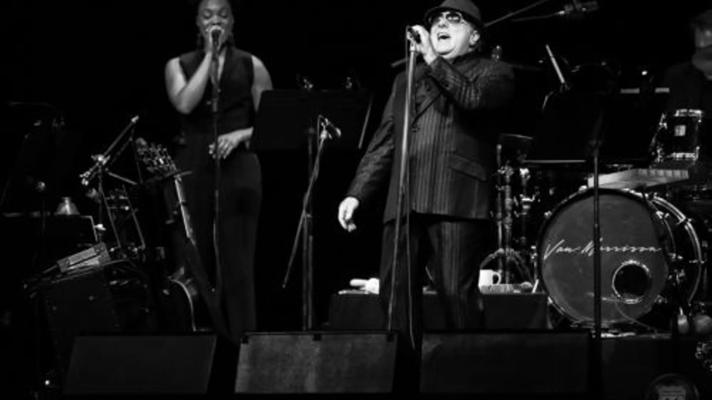 a man singing into a microphone