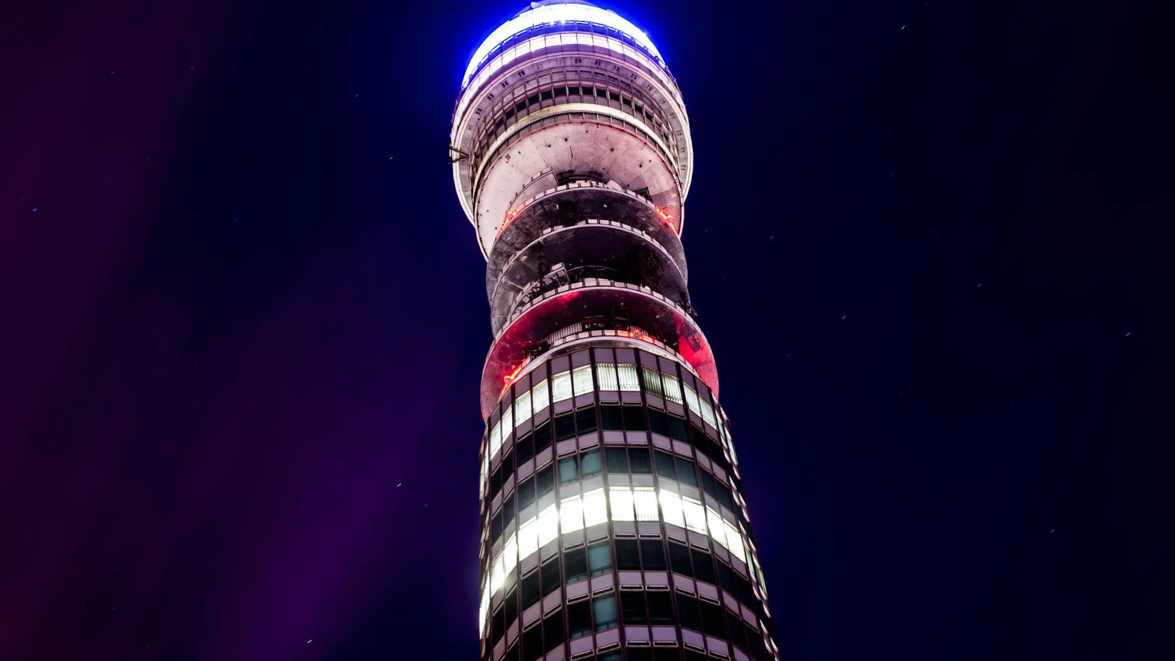 a tall building with a round top