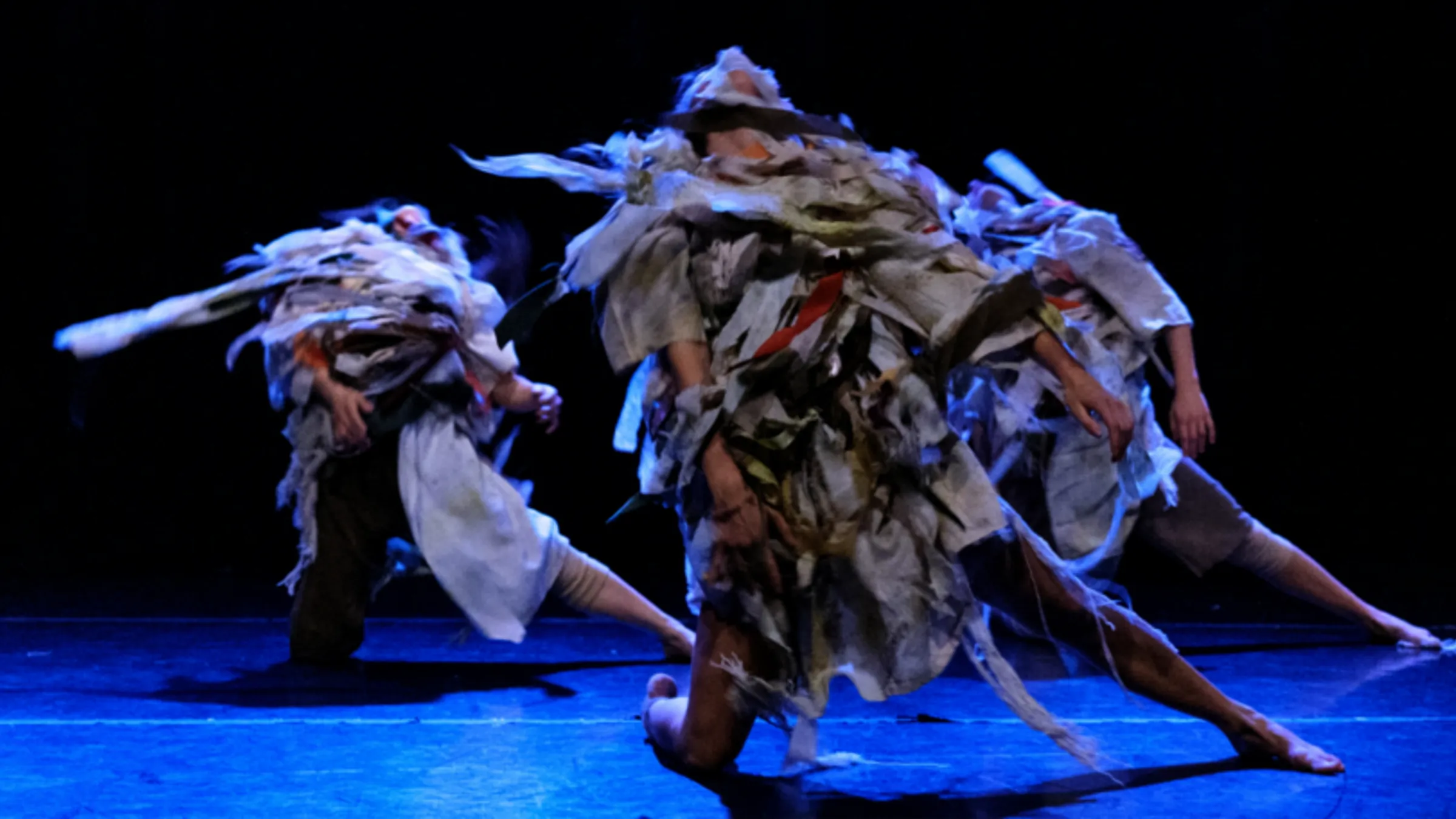 a group of people dancing on a stage