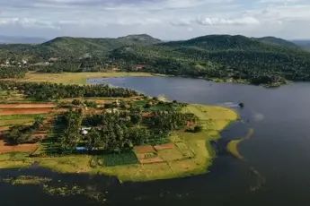 a aerial view of a lake surrounded by land