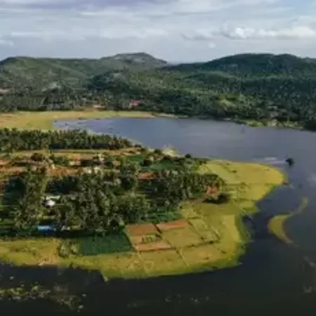 a aerial view of a lake surrounded by land