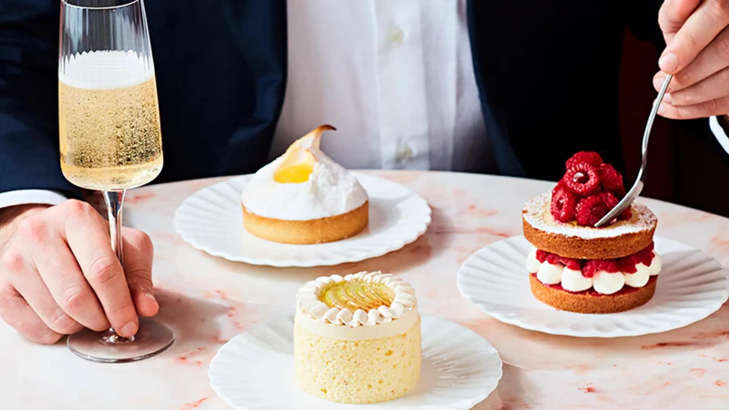 a person eating desserts on plates
