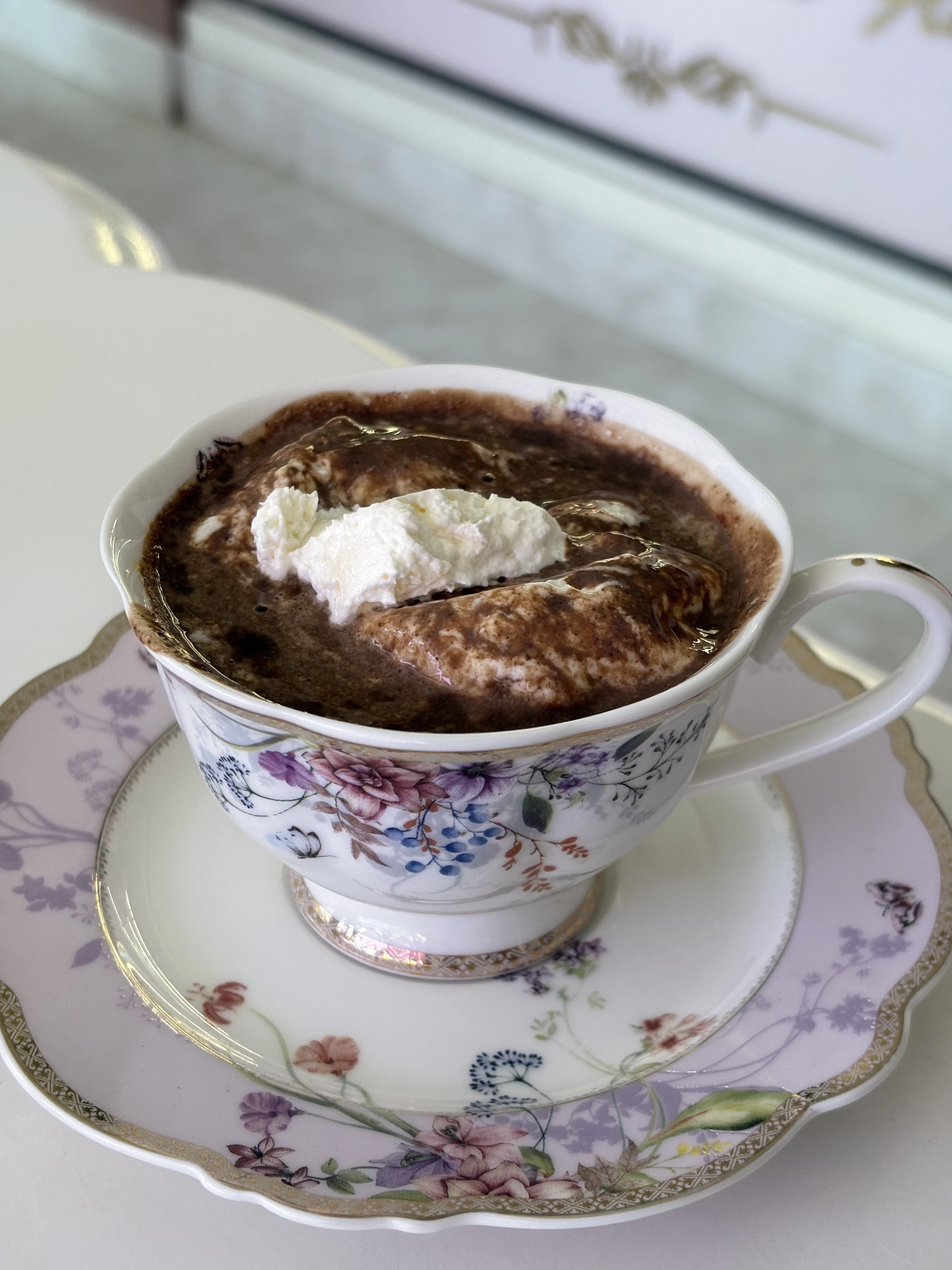 a cup of hot chocolate with whipped cream on top