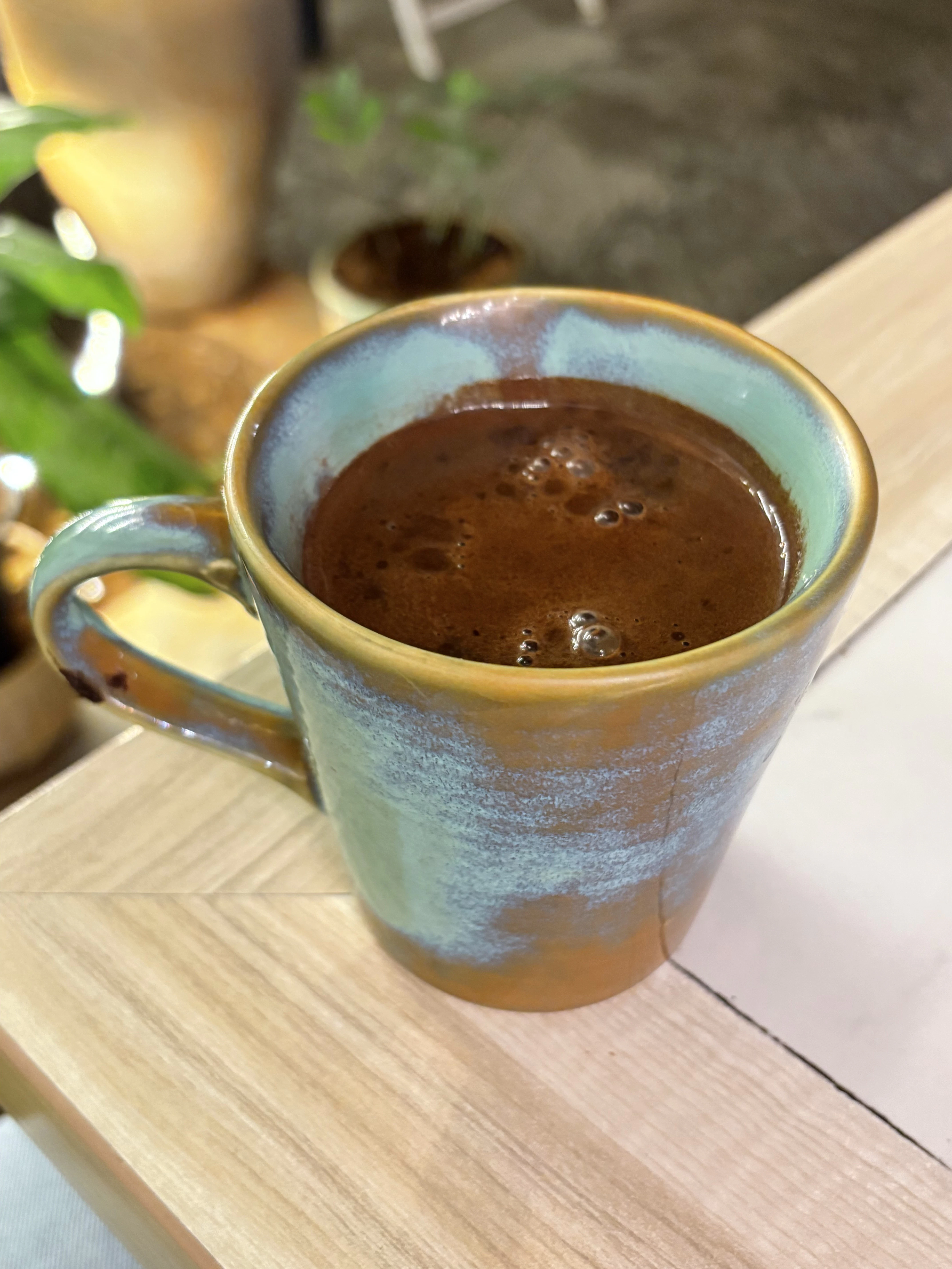 a cup of coffee on a table