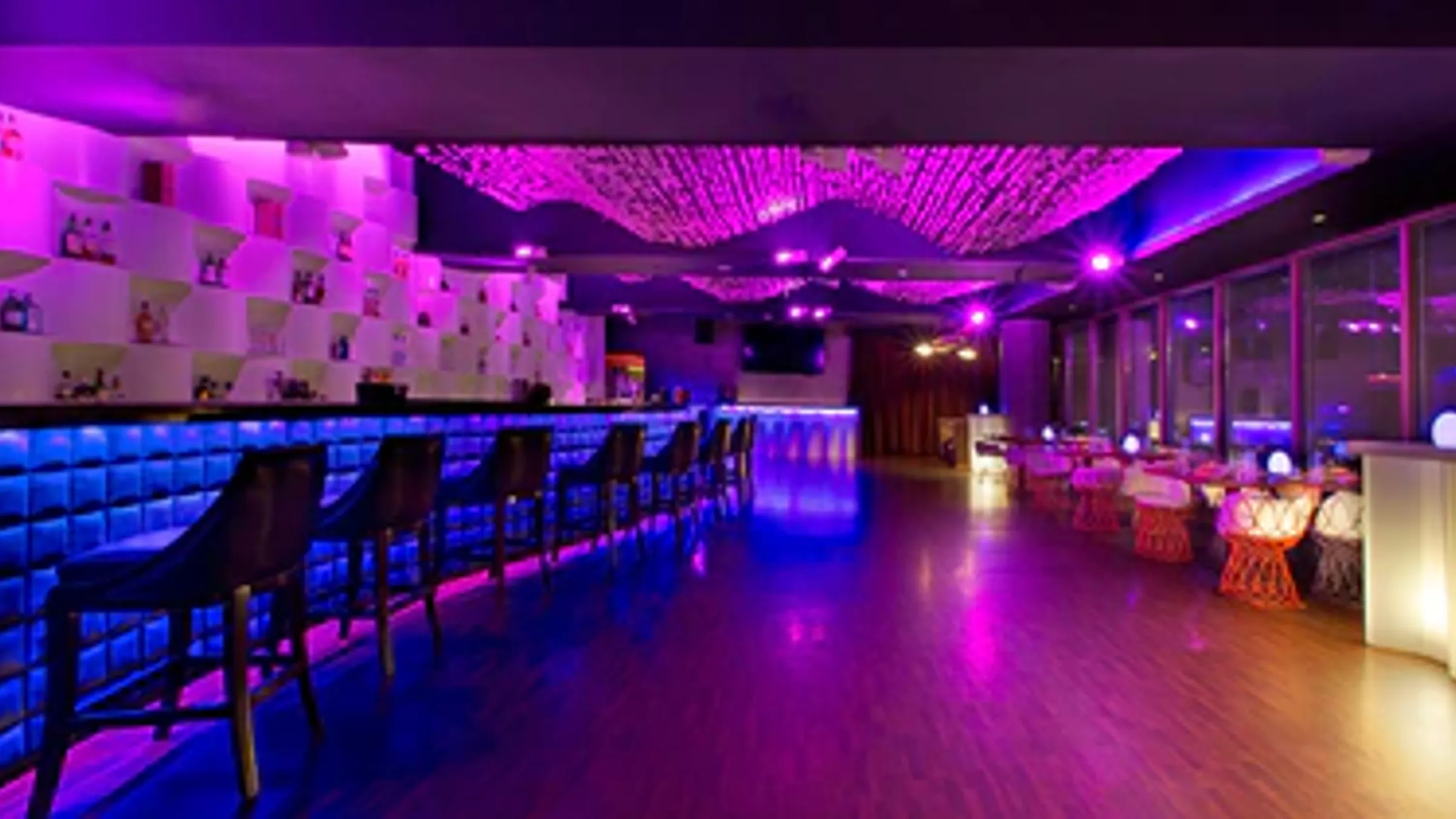 a bar with purple lights