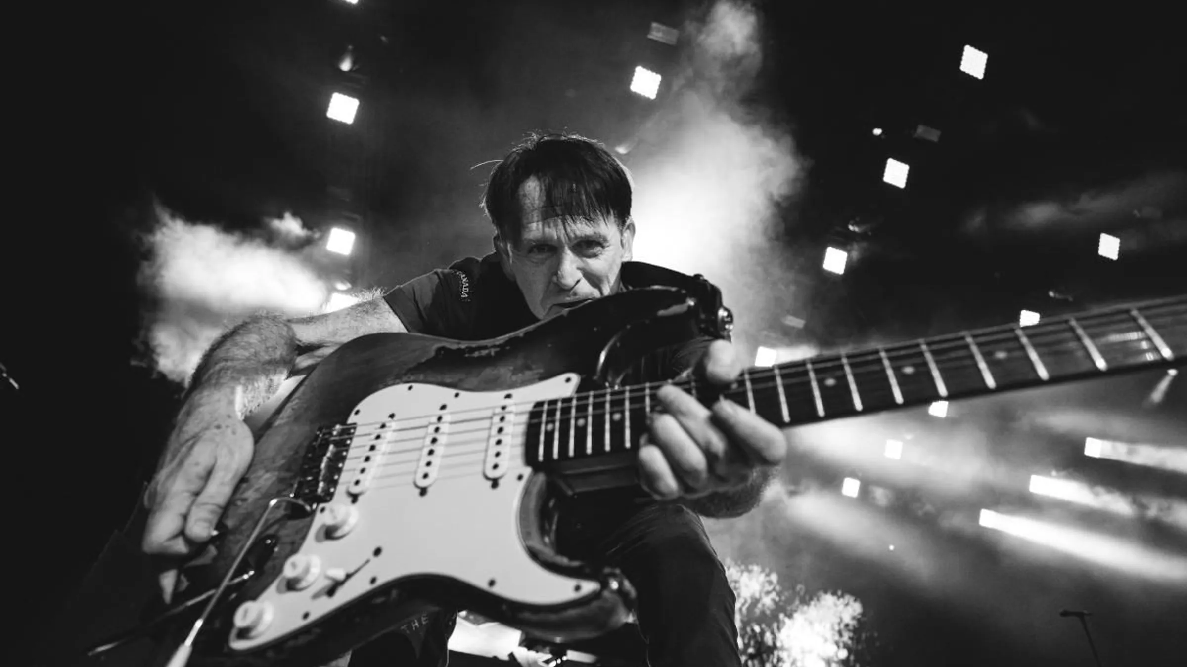 a man holding a guitar