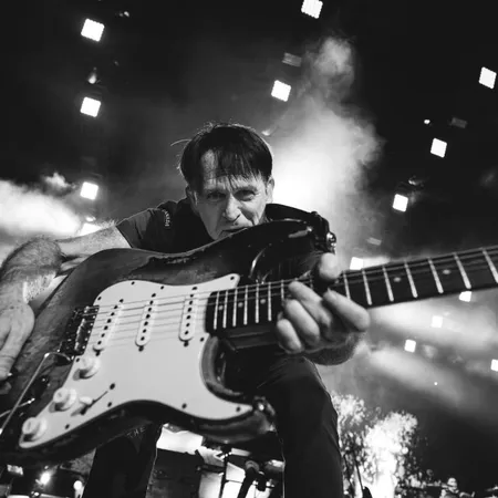 a man holding a guitar
