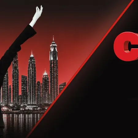 a woman in a suit and hat with her arms raised in front of a city