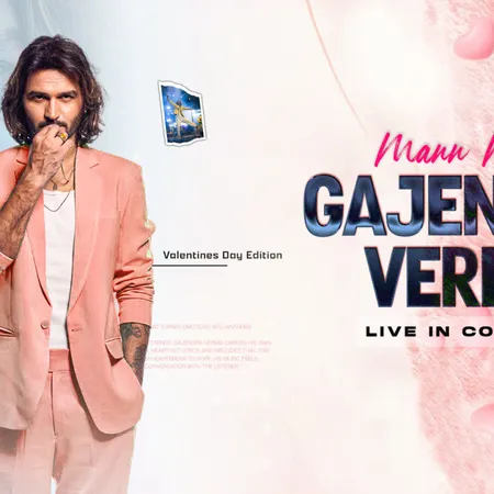 a man in a pink suit smoking a cigarette