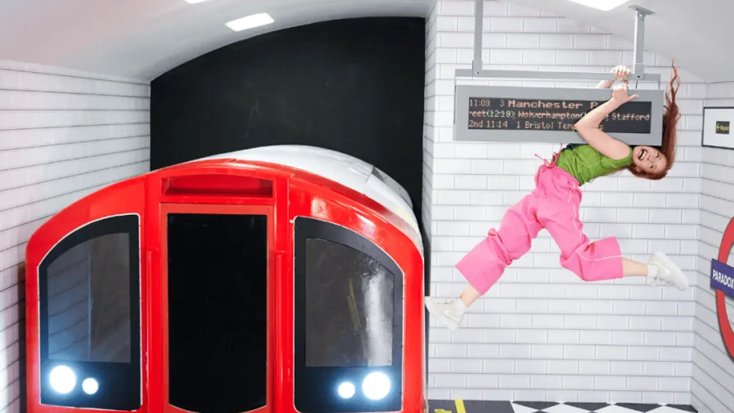 a woman jumping in a subway station