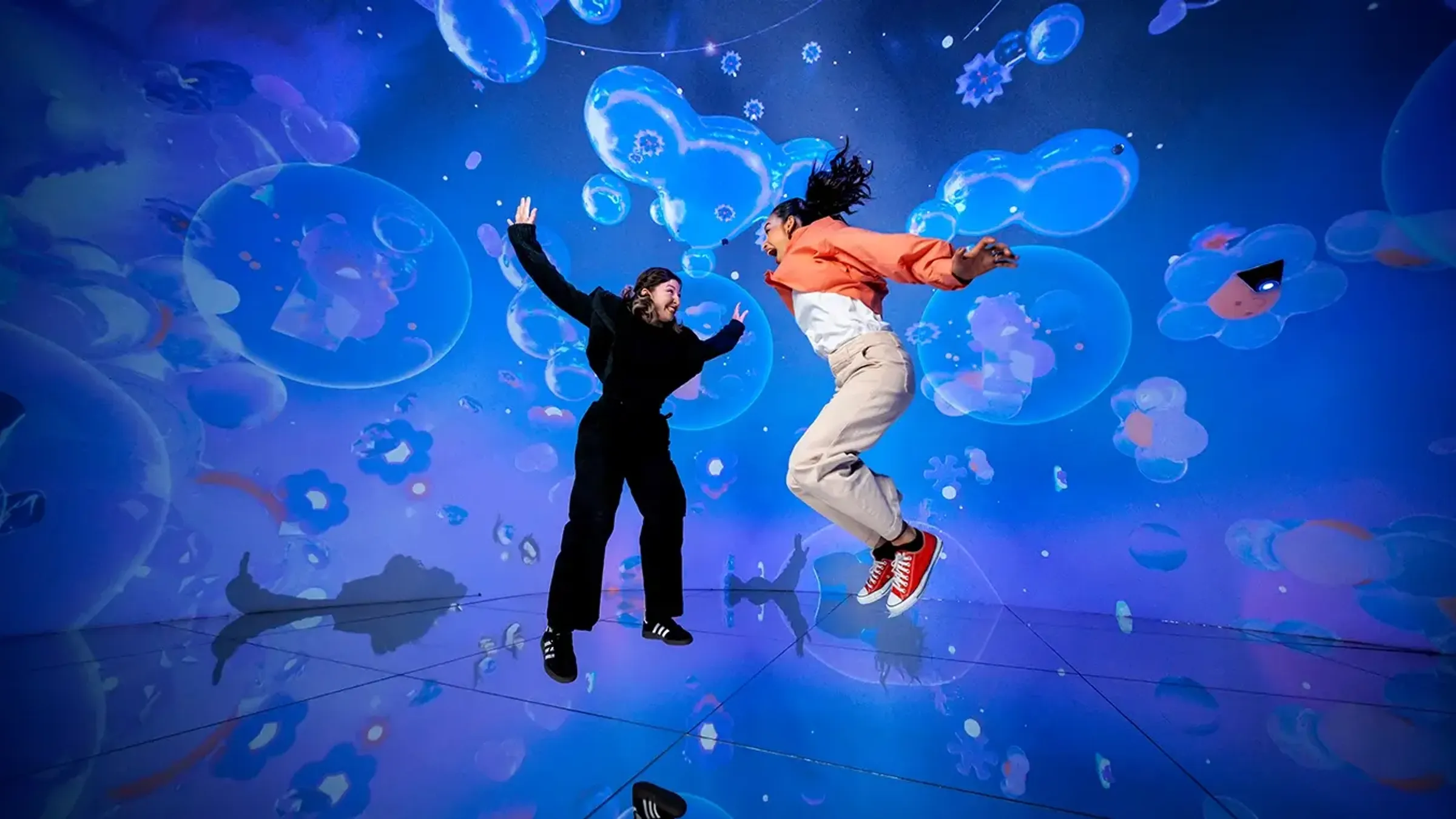 two women jumping in the air