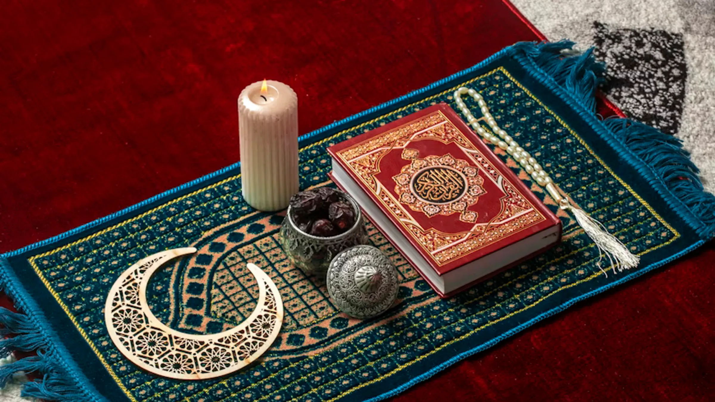 a candle and a book on a rug